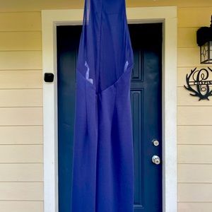 Brand new size 4 Navy dress , low netting in back with leg slit elegant sexy